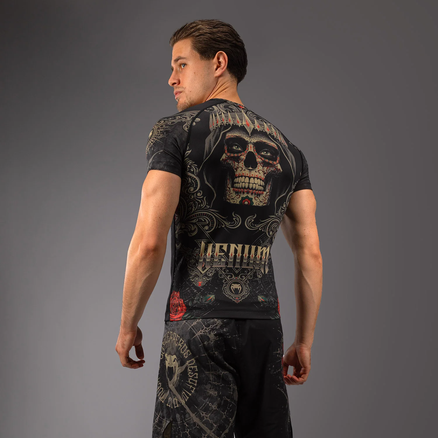 Venum Santa Muerte 5.0 Men’s Short Sleeve Rashguard - Deep Black/Gold - Image 3