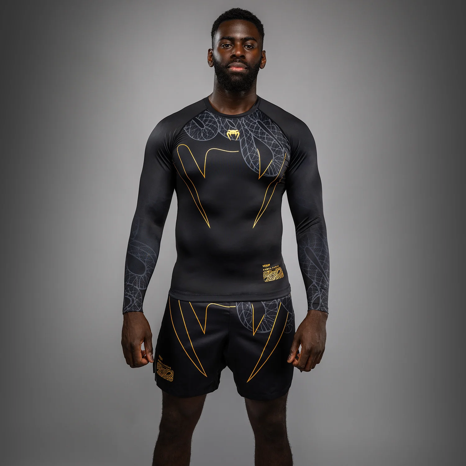 Venum Serpenti Long Sleeve Rashguard - Black/Silver/Gold - Image 2
